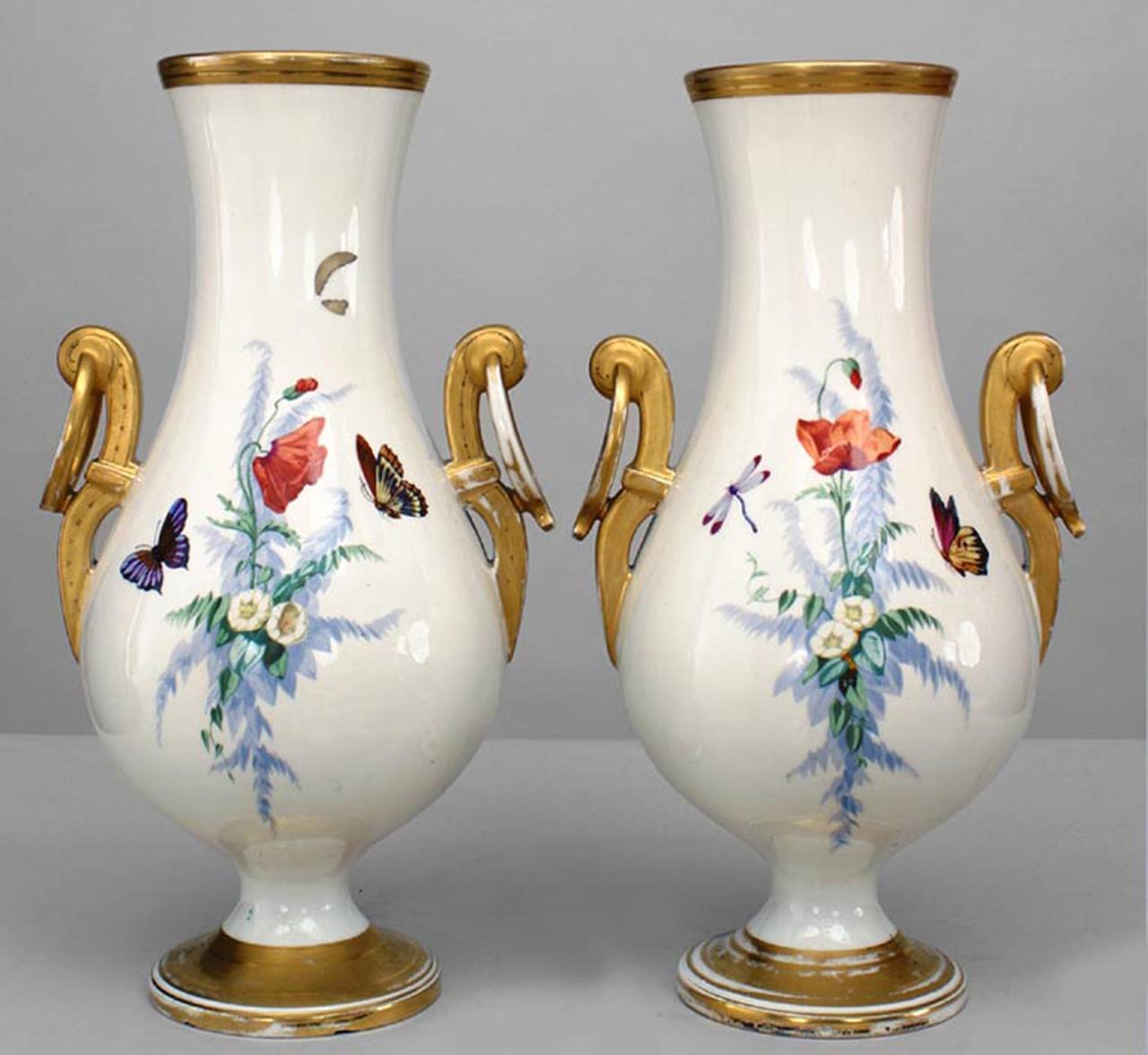 Pair of 19th century French white and gold porcelain vases decorated with poppies and insects with ring-form handles.