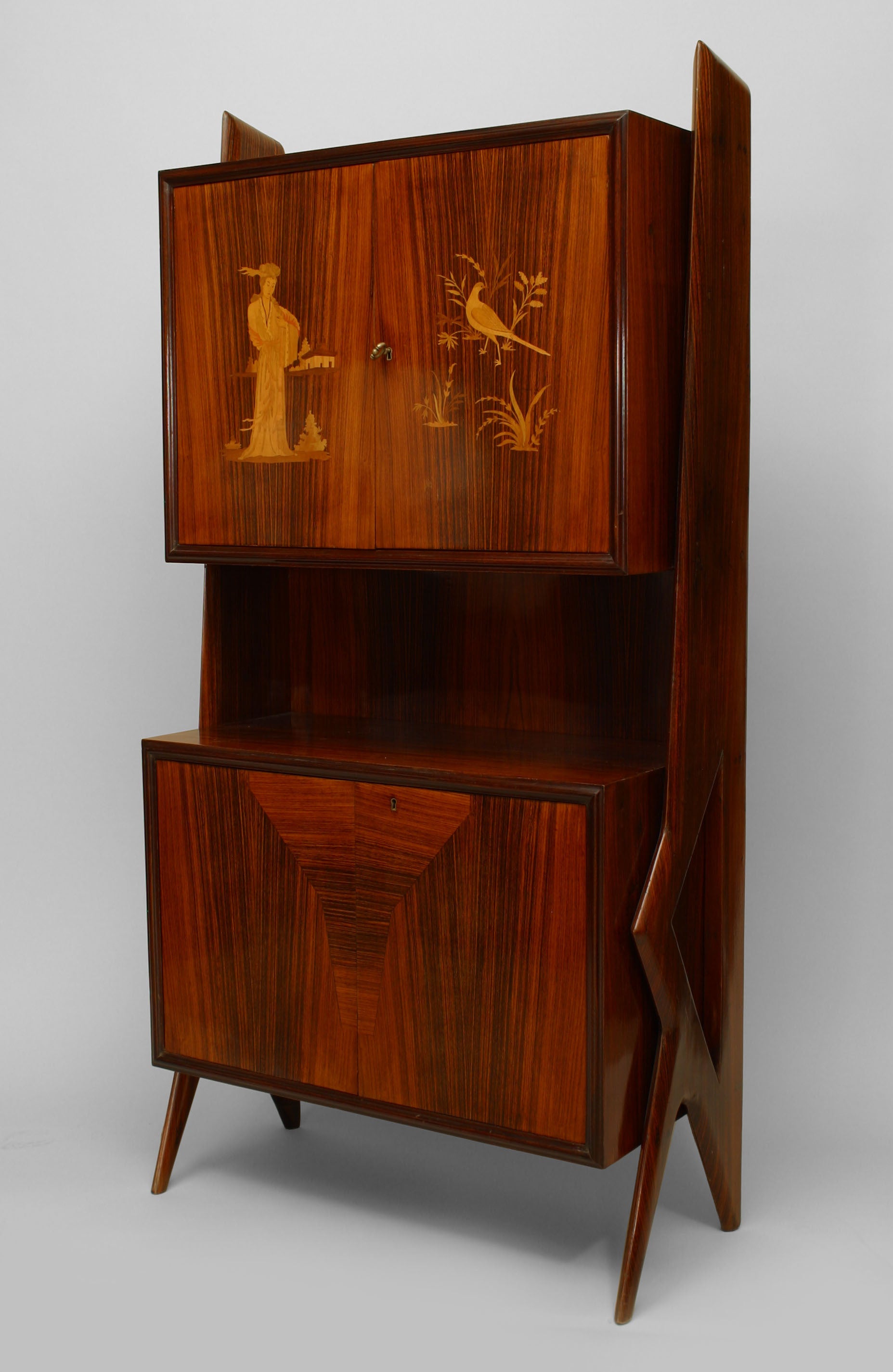 Italian 1950s rosewood cabinet with geometric form side supports and a 2 door inlaid upper section with a shelf above 2 lower doors with 4 interior drawers (ICO PARISI).
 