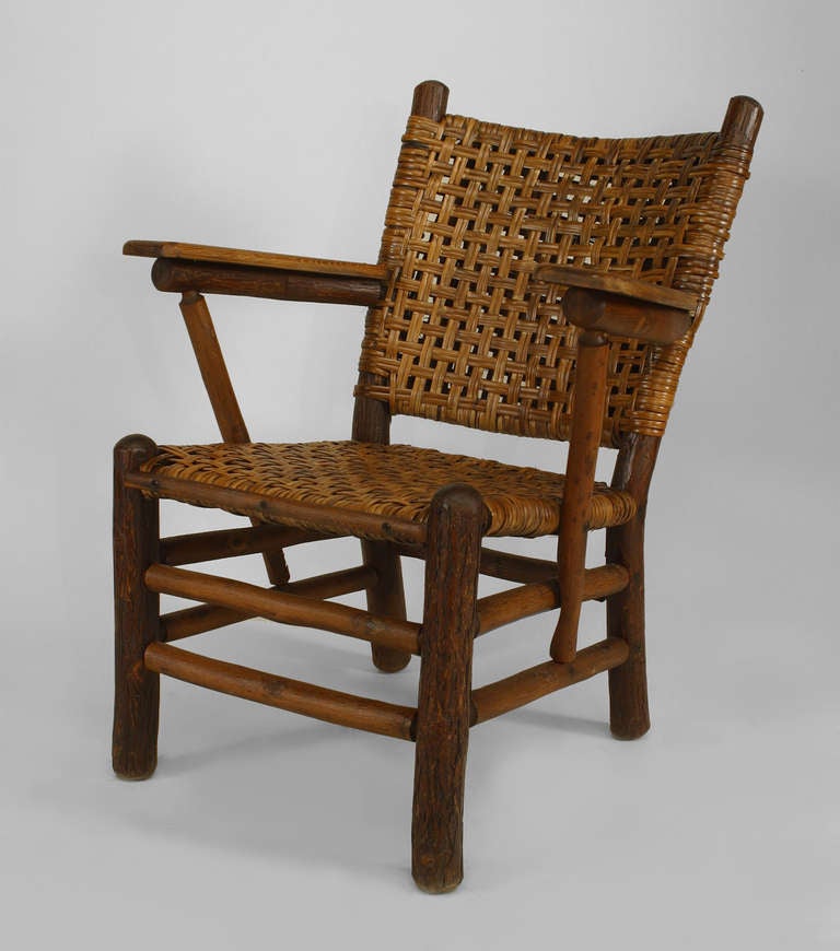 Rustic Old Hickory arm chair with woven seat and square back with paddle form arm rests and box stretcher branded: OLD HICKORY, MARTINSVILLE, INDIANA
