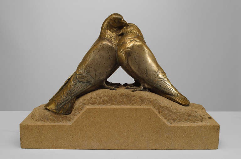 French Art Deco bronze figure of two pigeons snuggling on a beige marble base. 