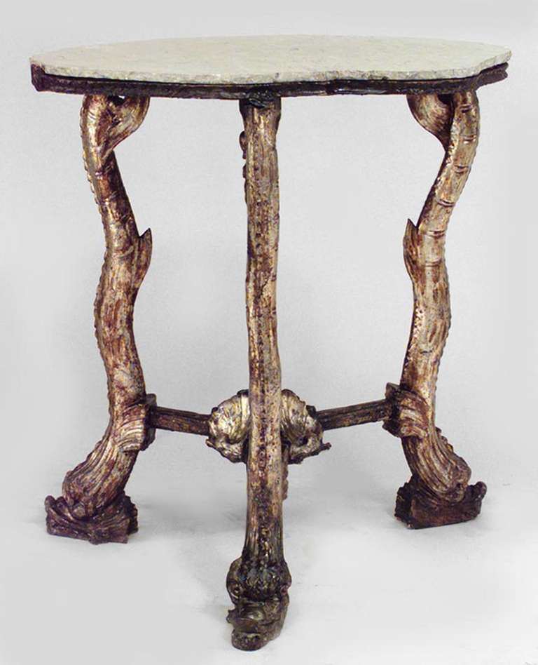 Nineteenth century Venetian Grotto style end table from the Franco Zefferelli Collection. This table is composed silver gilt woodith three carved dolphin headed legs joined by a seashell design stretcher beneath a brown marble top.