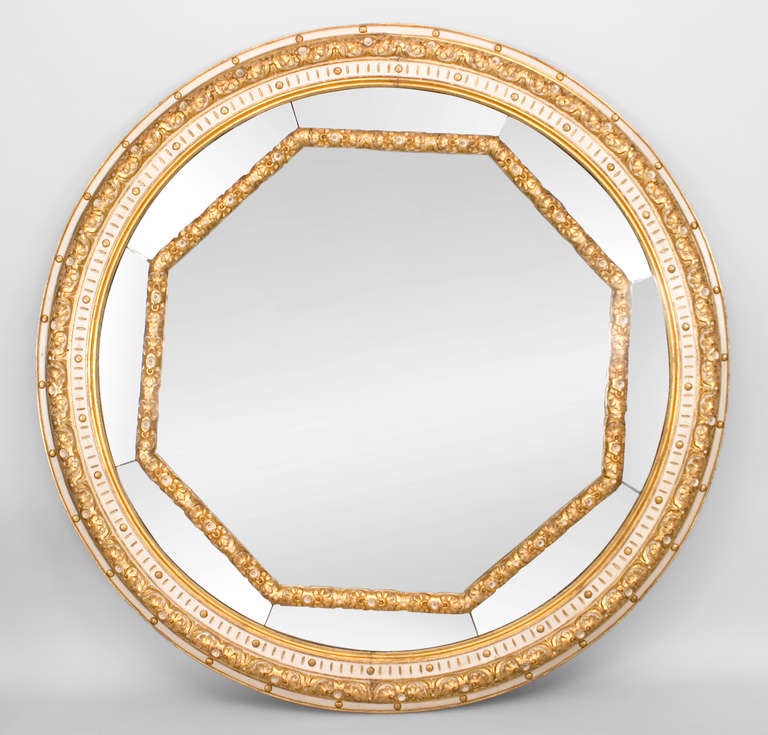 Pair of Italian Neoclassic-style (19th Century) monumental round wall mirrors with a white painted and gilt trimmed finish and an octagonal inset frame. (PRICED AS Pair)
