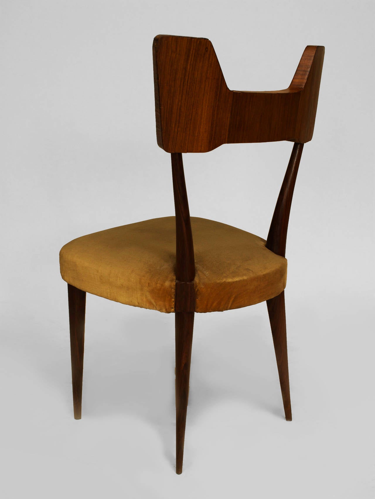 Set of eight 1950s Italian solid rosewood side chairs with rosewood veneered
shaped backs and upholstered seats.