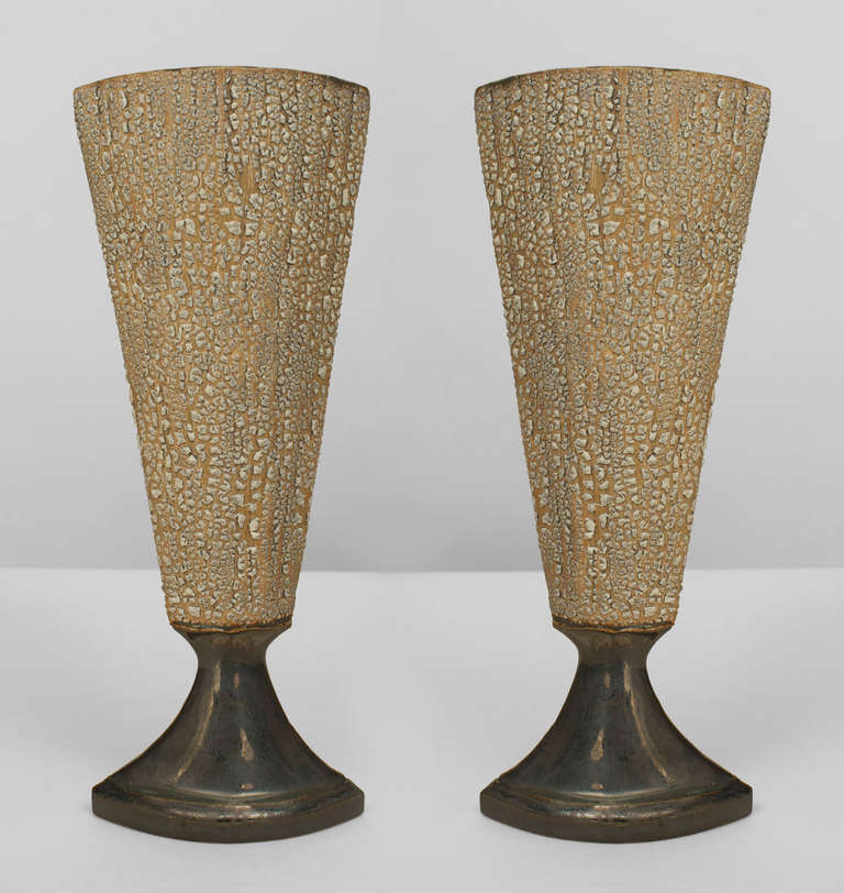 Signed by contemporary American artist Gary DiPasquale, a ceramic vase featuring a beige and white textured, elongated top supported by a smaller, flared base coated in a dark, contrasting iridescent glaze.

   