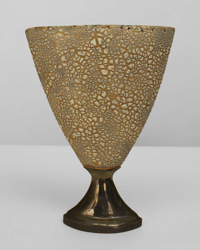 Signed by contemporary American artist Gary DiPasquale, this ceramic vase features a textured beige and white, chalice-form top supported by a smaller, flared base coated in a dark, contrasting iridescent glaze.