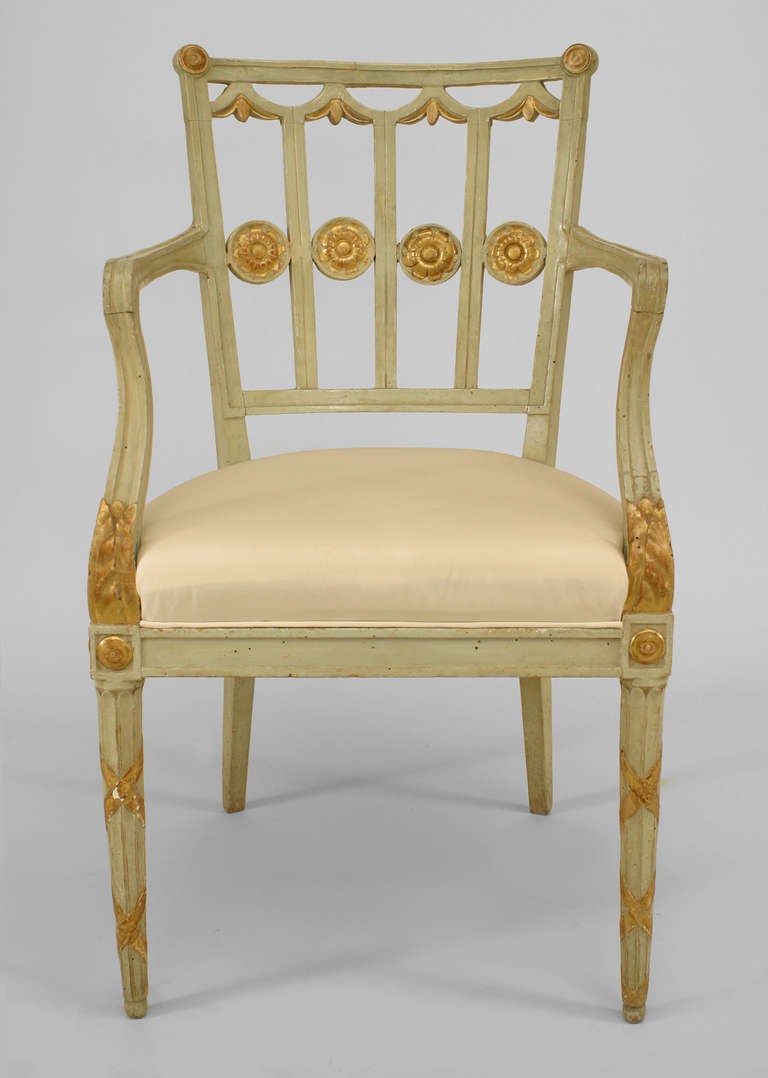 Set of six 18th century Italian neoclassic side chairs. Light chartreuse paint coats the chairs' forms, which feature open backs and tapered, fluted legs, as well as cushions upholstered in cream-colored fabric. Carved gilt details, such as trim,