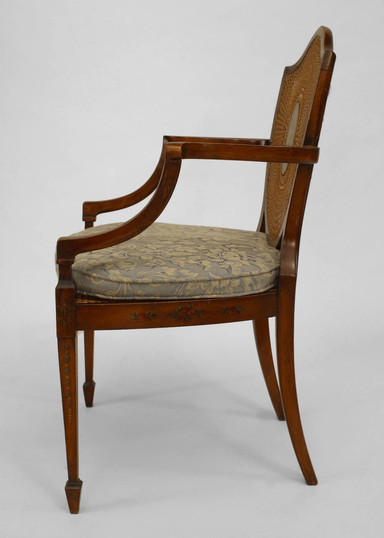 Pair of English Sheraton style (19th Cent) satinwood shield back Armchairs with painted and cane back panels.
