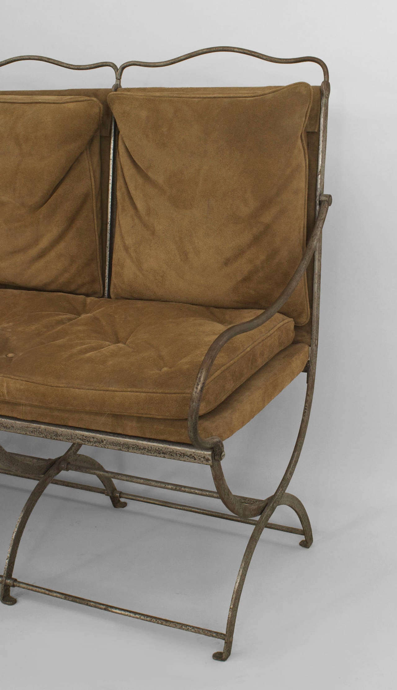 French 1940s steel settee with a four seat-back design and low scroll arms with
suede upholstered seat cushion and four back cushions.