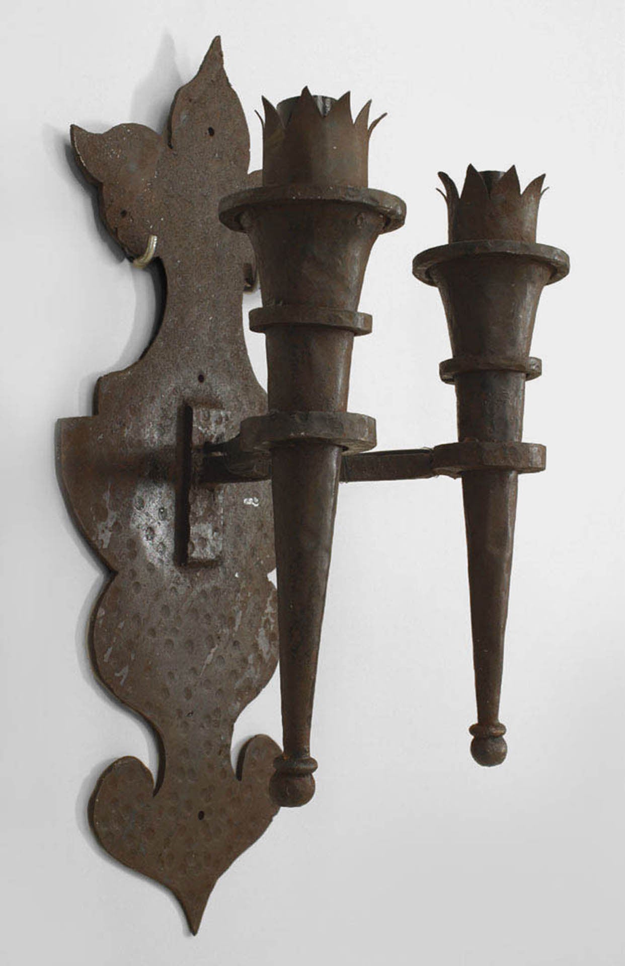 American Renaissance Revival style wrought iron wall sconces with double
torch design arms and shaped back plate, 20th century.