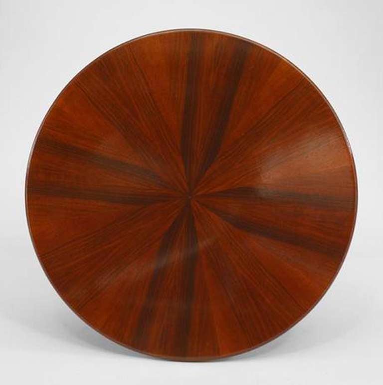 Italian Mid-Century (1940s) round coffee table with a rosewood veneered sunburst design top on a pedestal base with four brass splayed legs.
