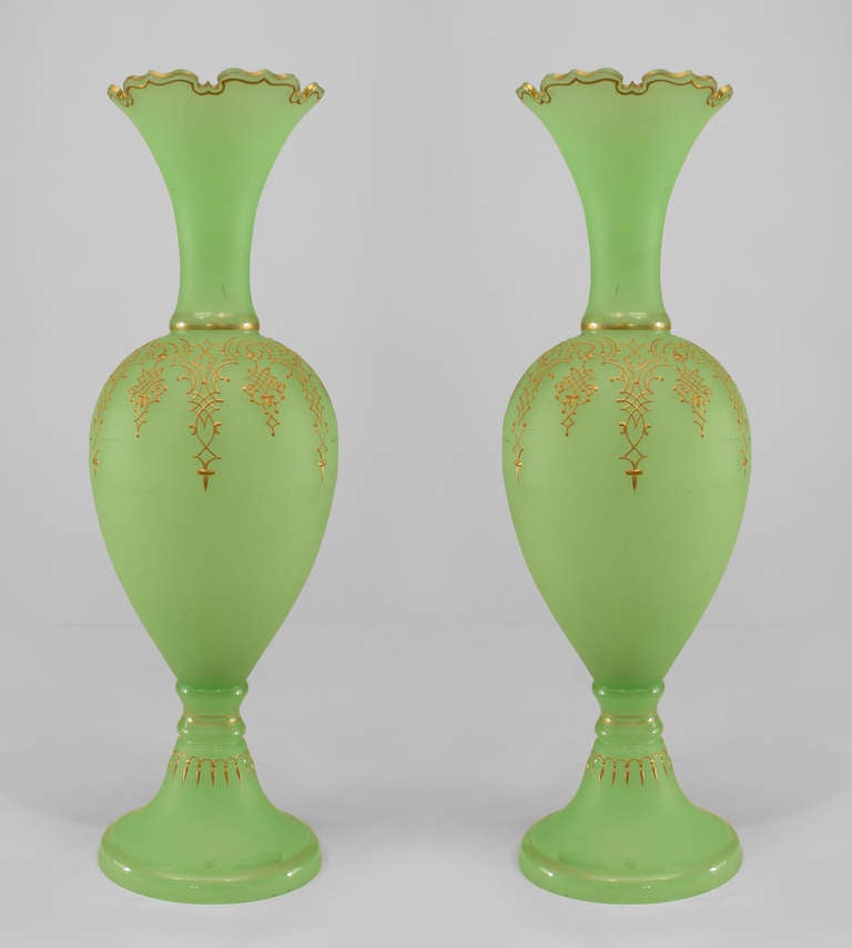 Pair of green opaline vases with scalloped tops and delicate gold decoration.