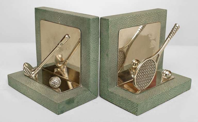 Pair of English bookends composed of green-tinted shagreen and decorated with silver plate tennis and golf paraphernalia.