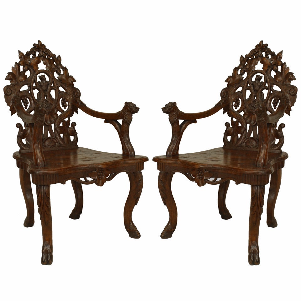 Pair of Rustic Black Forest Carved Walnut Armchairs For Sale