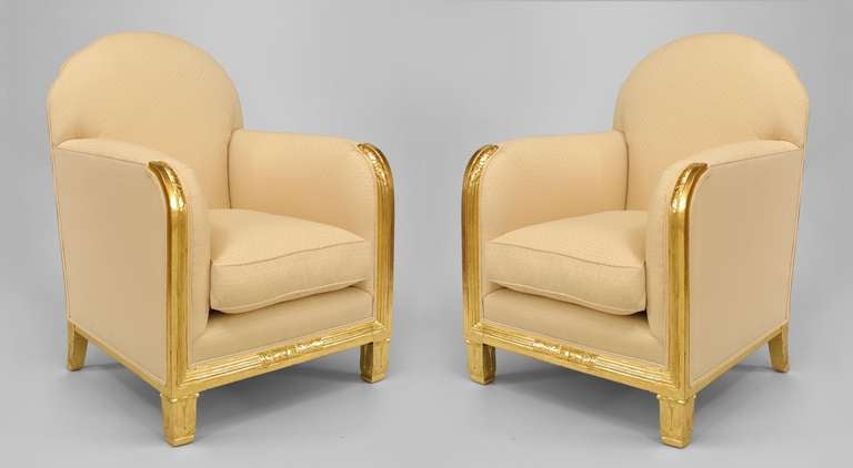Pair of French Art Deco gilt wood club chairs with scalloped design upholstered back and carved floral pattern on front of the arms and under seat frame (att: MAURICE DUFRENE)
