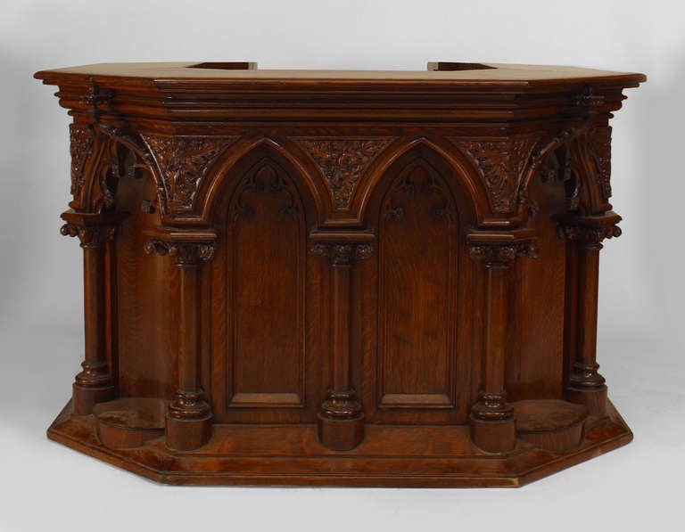 English Gothic Revival style (19/20th Cent) oak carved square shaped pulpit with arch design on all four sides with an open center
