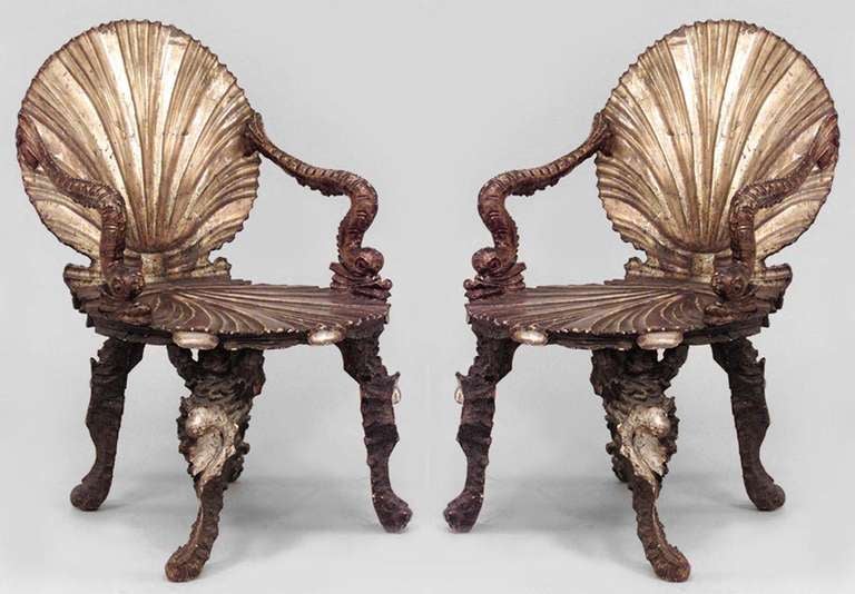 Originally from the noted Franco Zeffirelli Collection, this pair of nineteenth century Venetian grotto armchairs is composed of silver gilt wood and features carved seashell backs and seats with dolphin design arms.  

See dealer reference number