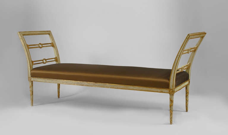 Italian Neo-classic (18th Century) celadon painted bench with gilt trim and open side arms with a raised inset set cushion and ribbon carved fluted legs.

