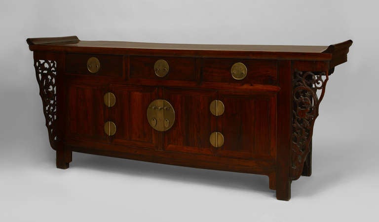 Asian Chinese (18th Century) rosewood (Hongmu) coffer sideboard with 3 drawers over a Pair of doors with brass hardware and filigree carved side panels.
 