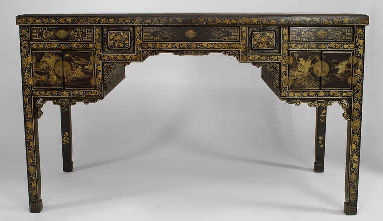 English Regency black lacquered chinoiserie desk with three drawers and two cabinets finished with brass pulls.