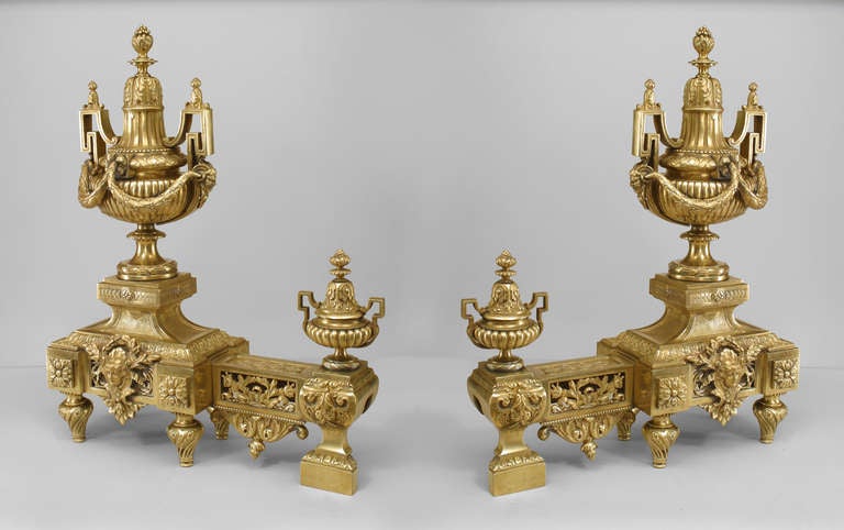 Pair of French Louis XVI style bronze dore double urn and festoon design andirons.