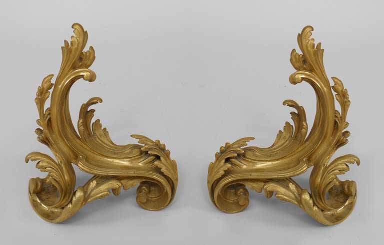 Pair of scrolling, foliate Louis XV style bronze chenets dating to nineteenth century France.
