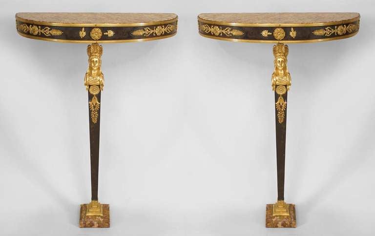 Pair of French Empire-style (19th Century) bronze and dore trim bracket console tables with half round marble top supported on a single leg ending in a square marble base. (PRICED AS Pair)
