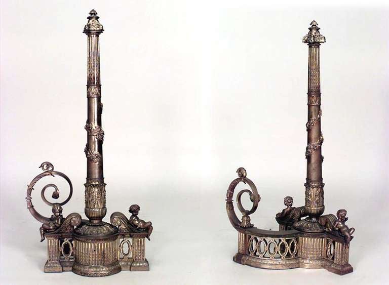 Pair of French Louis XVI-style (19th Century) bronze dore andirons with fluted design and cupids on base with scroll back. (PRICED AS Pair)
