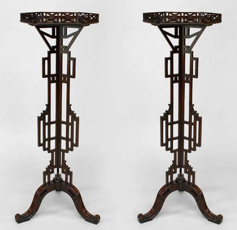 Pair of nineteenth century English Chinese Chippendale pedestals composed of mahogany in a lattice design with six-sided open gallery tops.