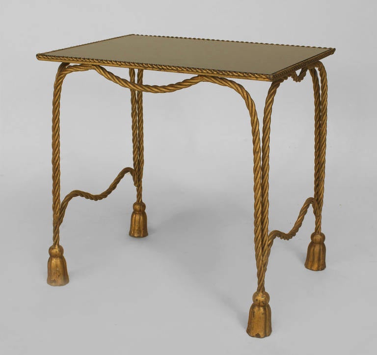 1940's Italian rope and tassel design low gilt metal end table with a rectangular inset black glass top resting upon four rope-form legs with side stretchers.