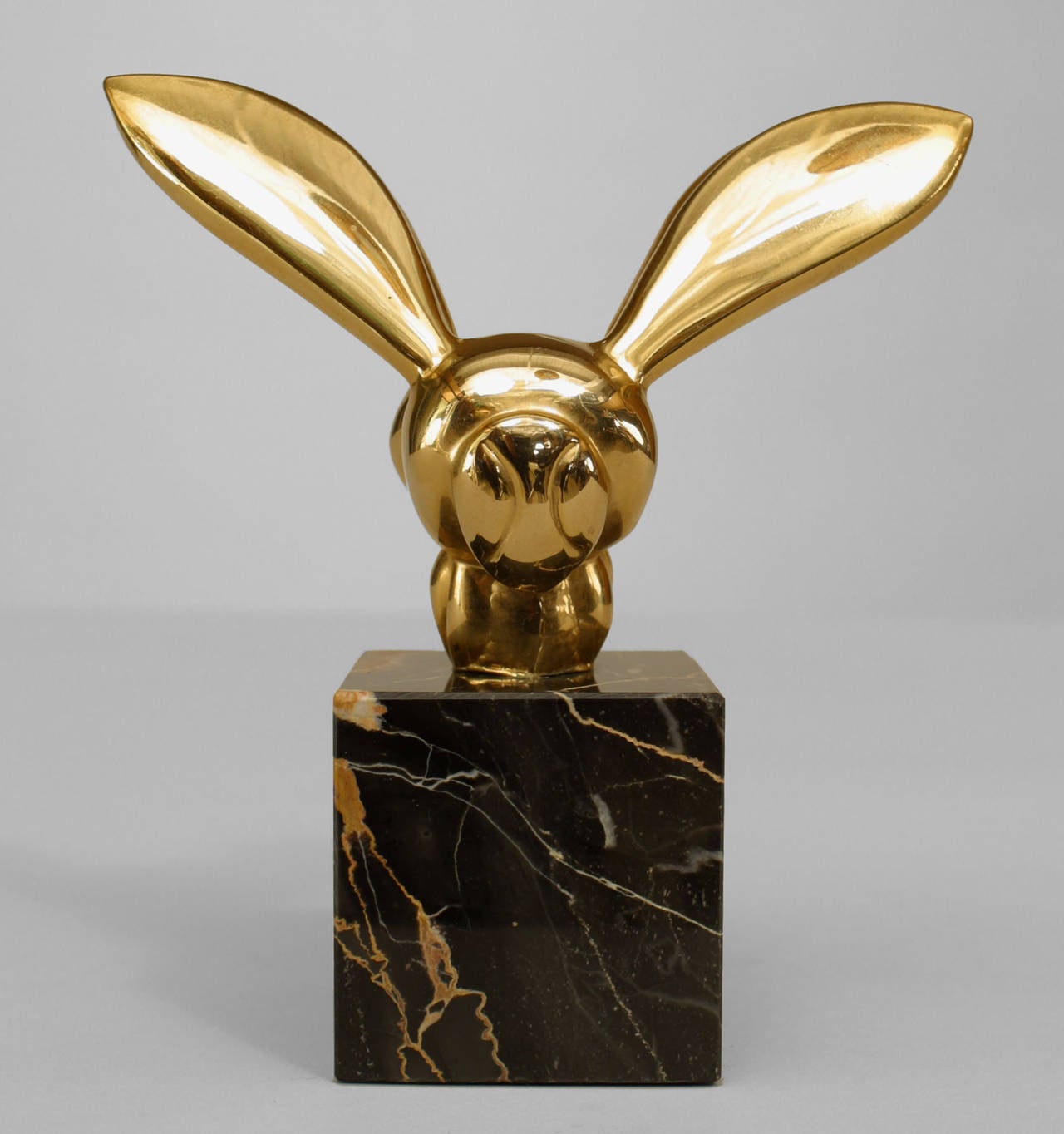 American Mid-Century Modern brass sculpture of a bee mounted on a square
black marble base after G. Lachaise by Alva Museum Reproductions.