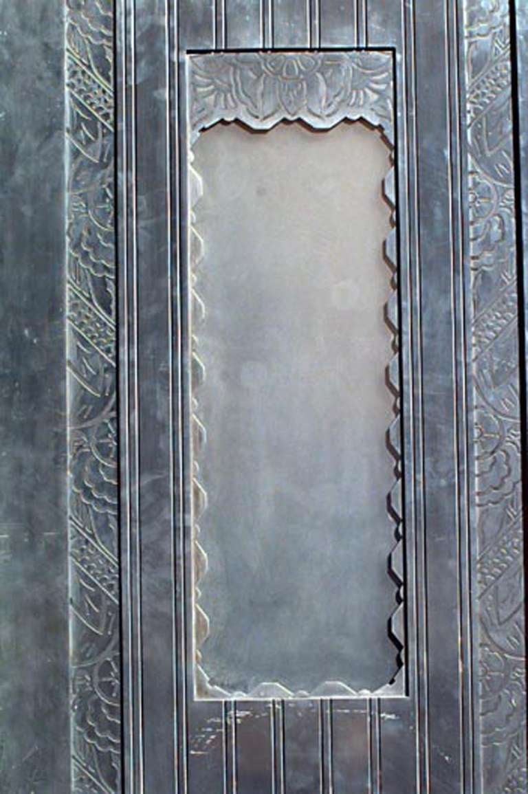 Pair of American Art Deco steel elevator door panels with floral etched trim and narrow scalloped edge frosted glass windows.