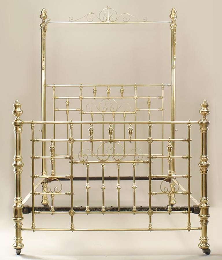 Nineteenth century American brass queen sized bed with a spindle design frame and side canopies.