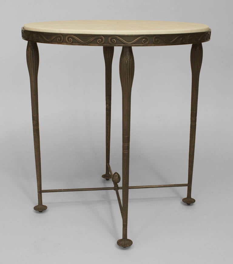 Contemporary American Art Deco style end table by Carole Gratale in the manner of Rateau. The table features a circular Shagreen top inset in a bronze frame supported by four fluted legs and a low intersecting stretcher.

Note: Tops and sizes are