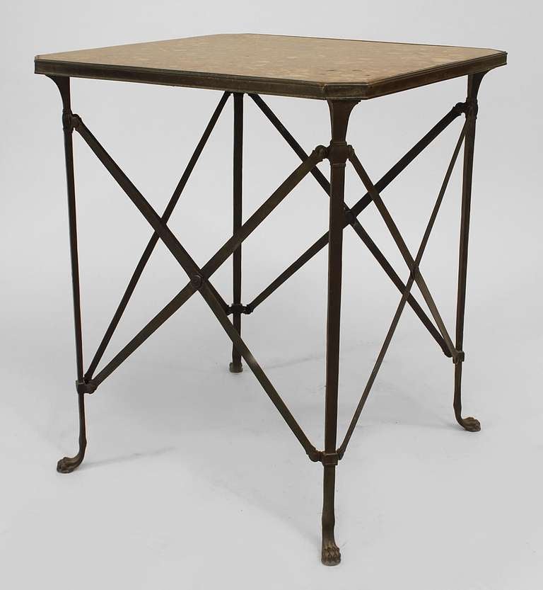 Twentieth century French Empire style end table with a bronze campaign style base with four crossed legs and clawfeet beneath a square rouge marble top.