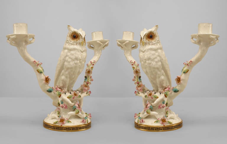 Pair of mid-19th century English porcelain two-arm candelabras designed in the form of owls propped upon blooming branches.