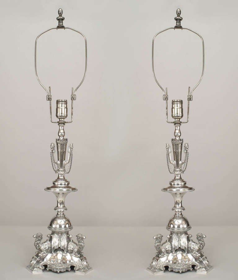 Pair of English Regency style (19th Century) silver plate table lamps with triple camel base (PRICED AS Pair).
