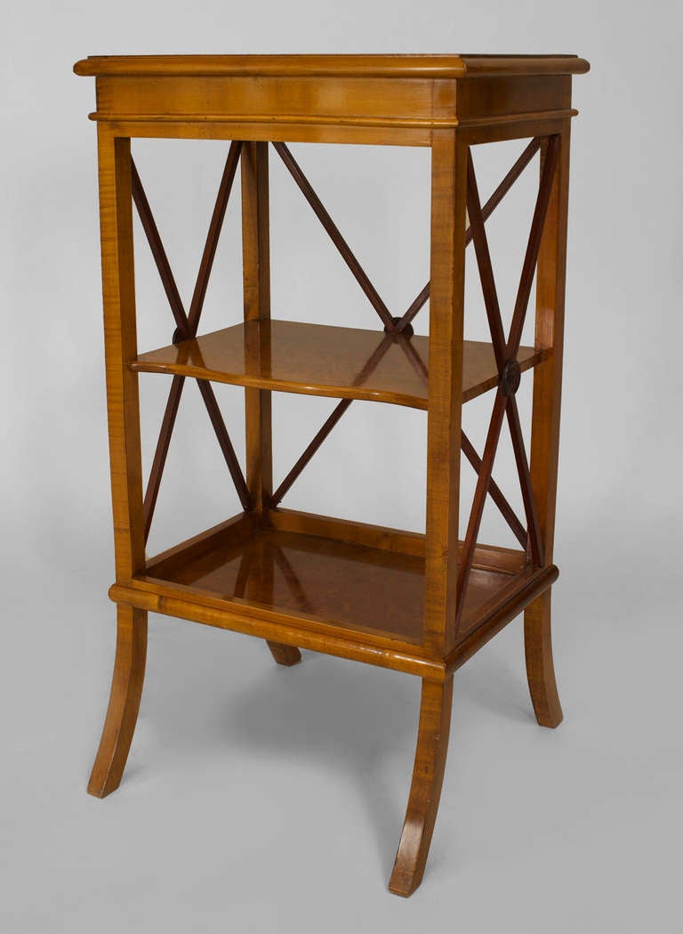 Pair of twentieth century Swedish Biedermeier style maple end tables resting upon four splayed feet with two shelves and mahogany x-form sides.