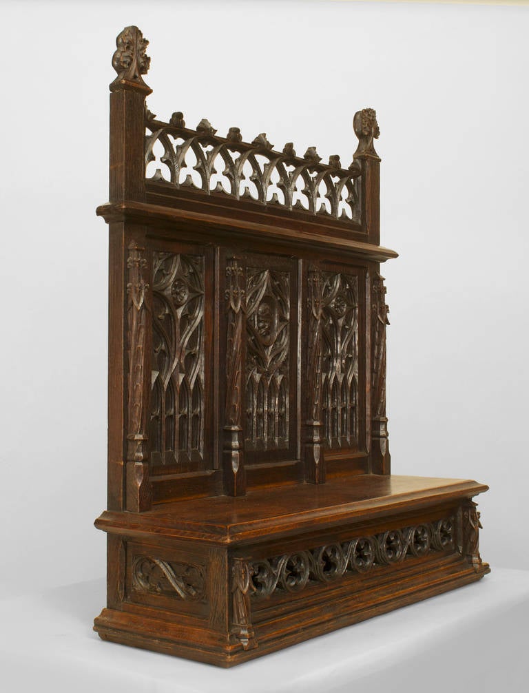 English Gothic style (19th Cent) dark oak table top altar with a filigree shelf under 3 tracery carved panels with an open lattice gallery
