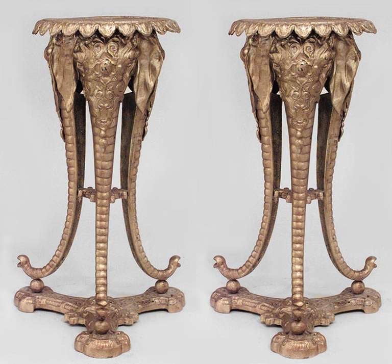 Pair of English Regency style gold painted bronze tripod pedestals with elephant head design. (19th Cent)

