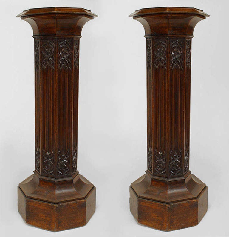 Pair of nineteenth century English Gothic Revival octagonal pedestals composed of mahogany and carved with lattice designs.