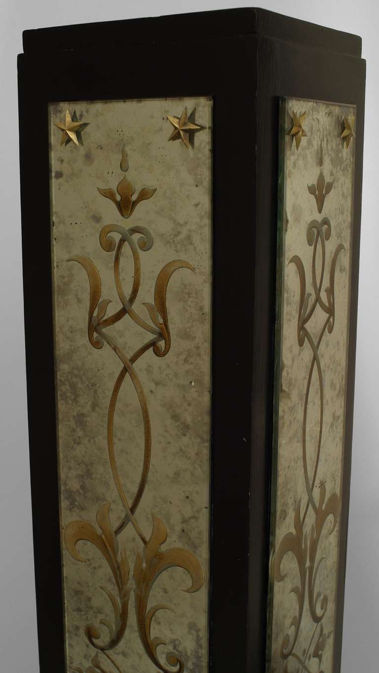 Art Deco black lacquered square pedestal with four mirror panels decorated with gilt eglomise foliate details.