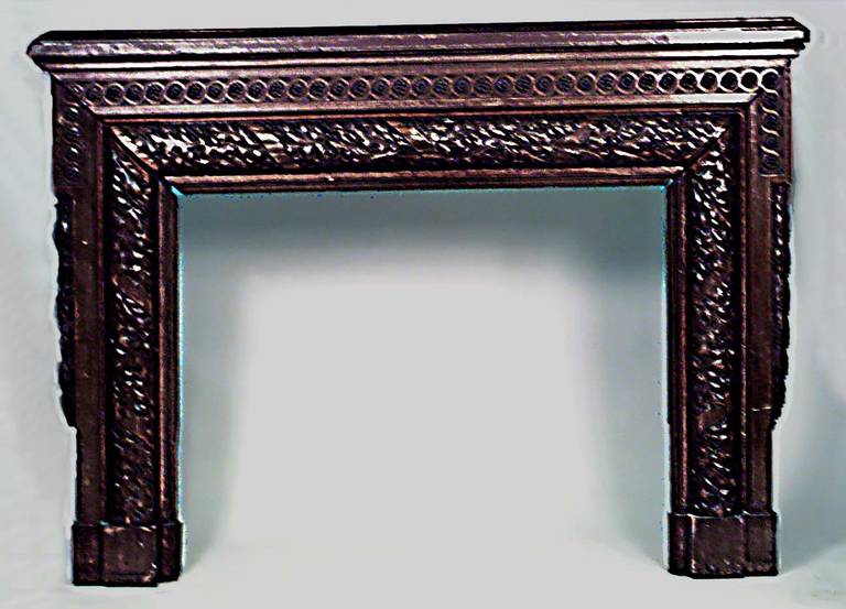 American Victorian carved walnut fireplace mantel surround with acorn and leaf design.
