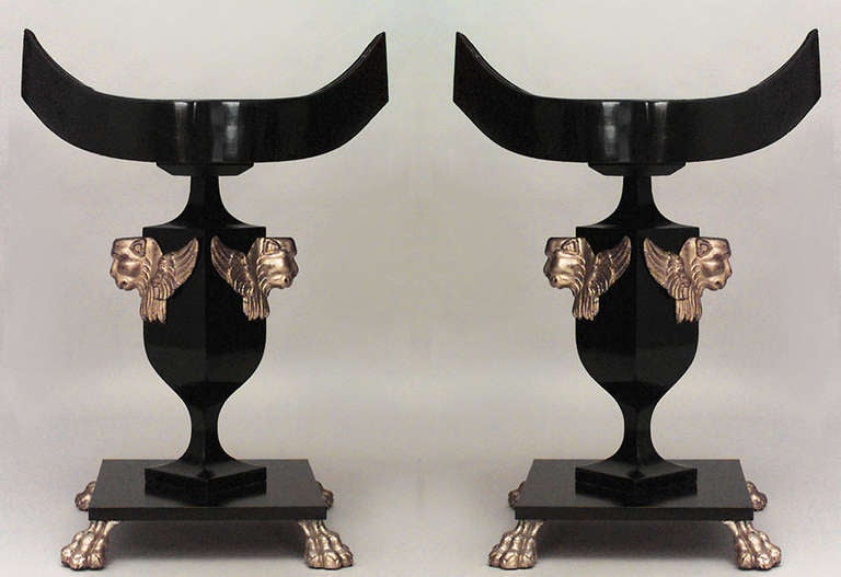Pair of English Regency style (19th Cent) black lacquered and gilt lions head planter/fernery stand with square pedestal base.
