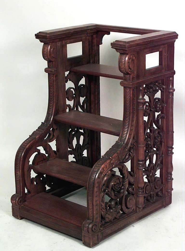 Set of French Victorian style walnut library steps with 4 steps & pierced scroll-carved sides & molded railing (1st ¬º 20th Cent)
