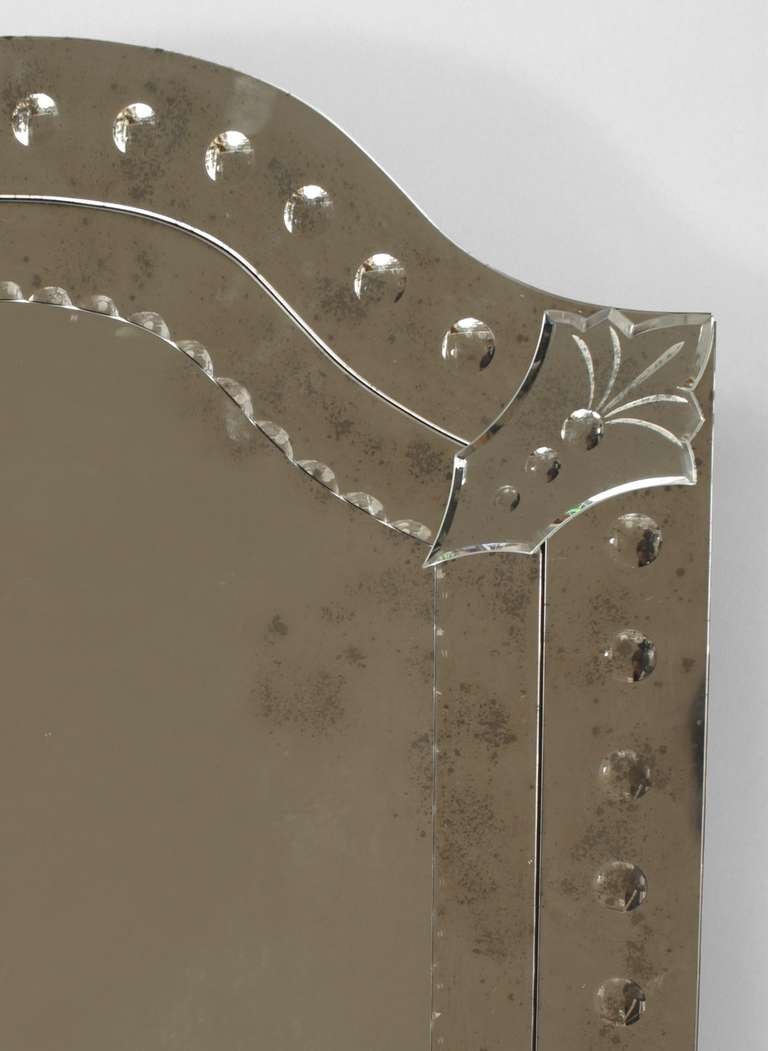 Italian Venetian Murano (21st Century) rectangular wall mirror with rounded tops and frames of applied glass panels with dot designs. 
