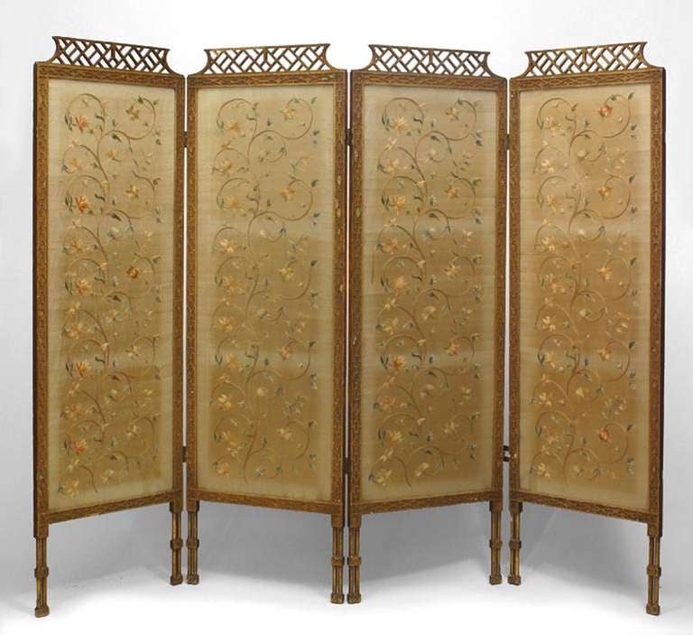 Nineteenth century English Chinese Chippendale four fold screen with silk panels embroidered with floral chinoiserie patterns framed in giltwood carved with filigree fretwork tops.