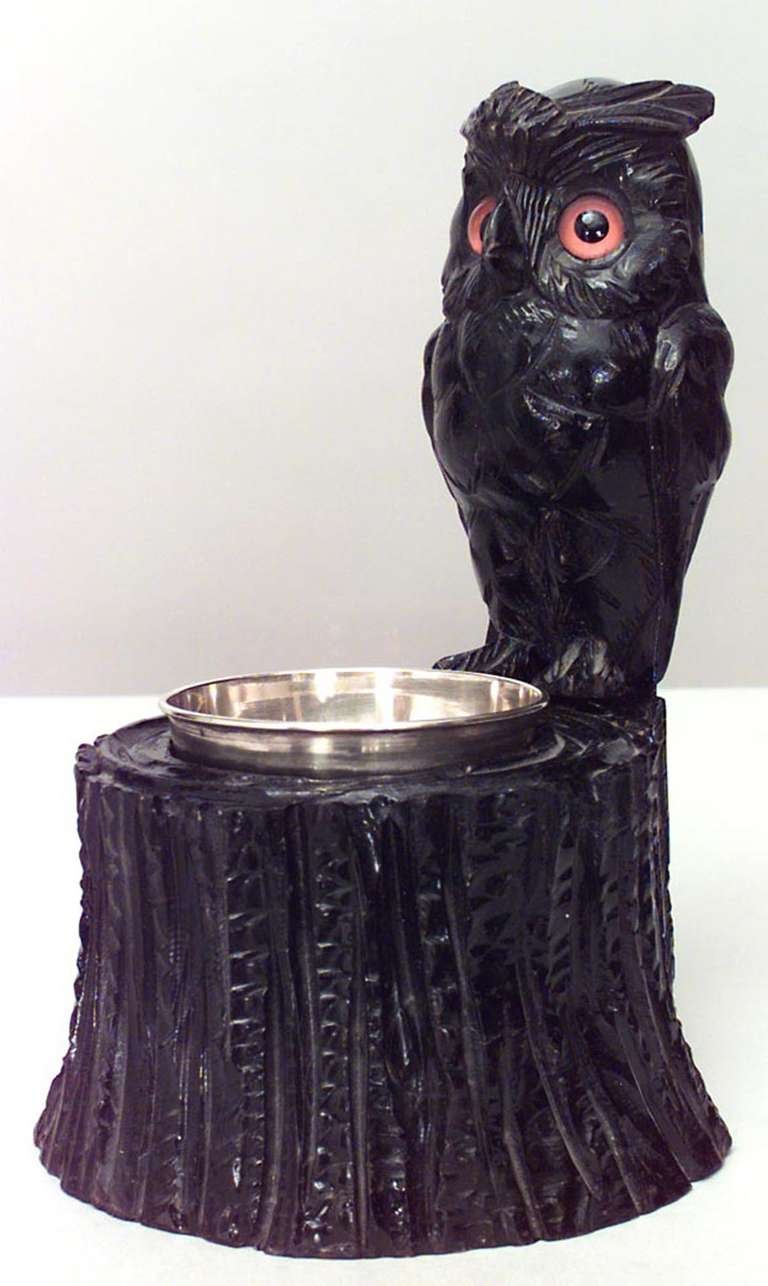 Nineteenth century English ashtray composed of concave brass set in ebonized wood carved in the form of an owl perched upon a tree stump.