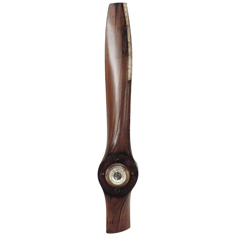 Art Deco wood propeller with barometer.
