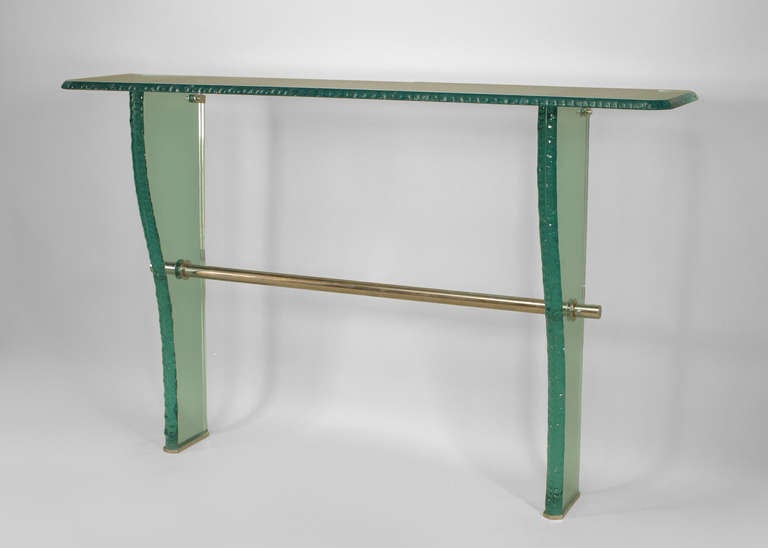 1940s Italian console table by Max Ingrand for Fontana Arte. The table is composed of molded edge glass with a rectangular top supported by a pair of tapered supports and a tubular chrome stretcher.