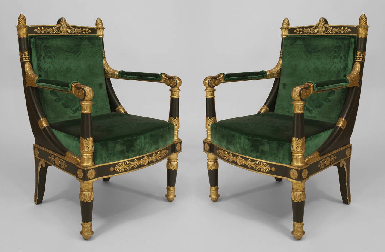 Pair of late eighteenth or early nineteenth century French Empire gilt and green lacquered armchairs with green upholstery.